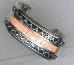 Silver overlay bracelet with pink coral inlay.