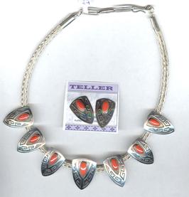 Coral necklace by Everett and Mary Teller on woven silver chain.  Matching earrings.